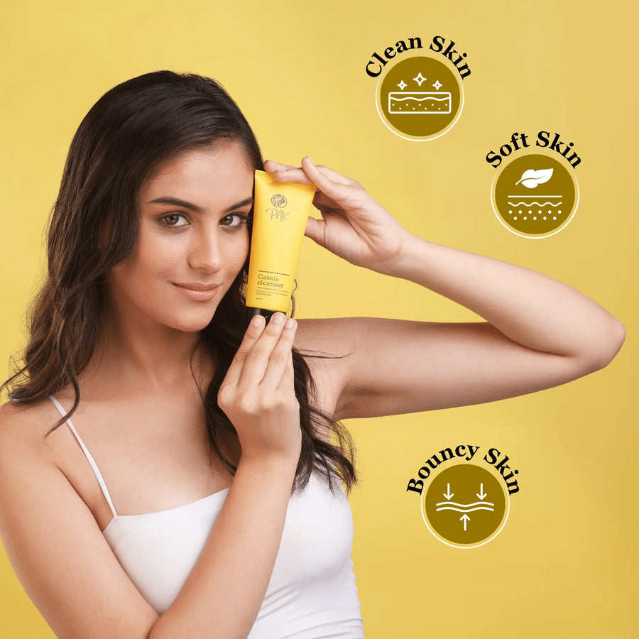 Woman holding Cassia cleanser for clean, soft, bouncy skin — gentle skincare for all skin types