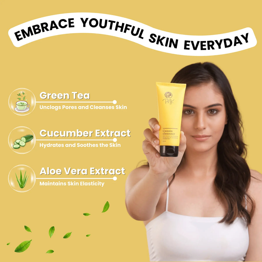Woman holding yellow Cassia cleanser with green tea, cucumber & aloe vera for youthful, glowing skin care routine
