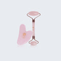 Pink rose quartz face roller and gua sha tool for skincare routine and facial massage